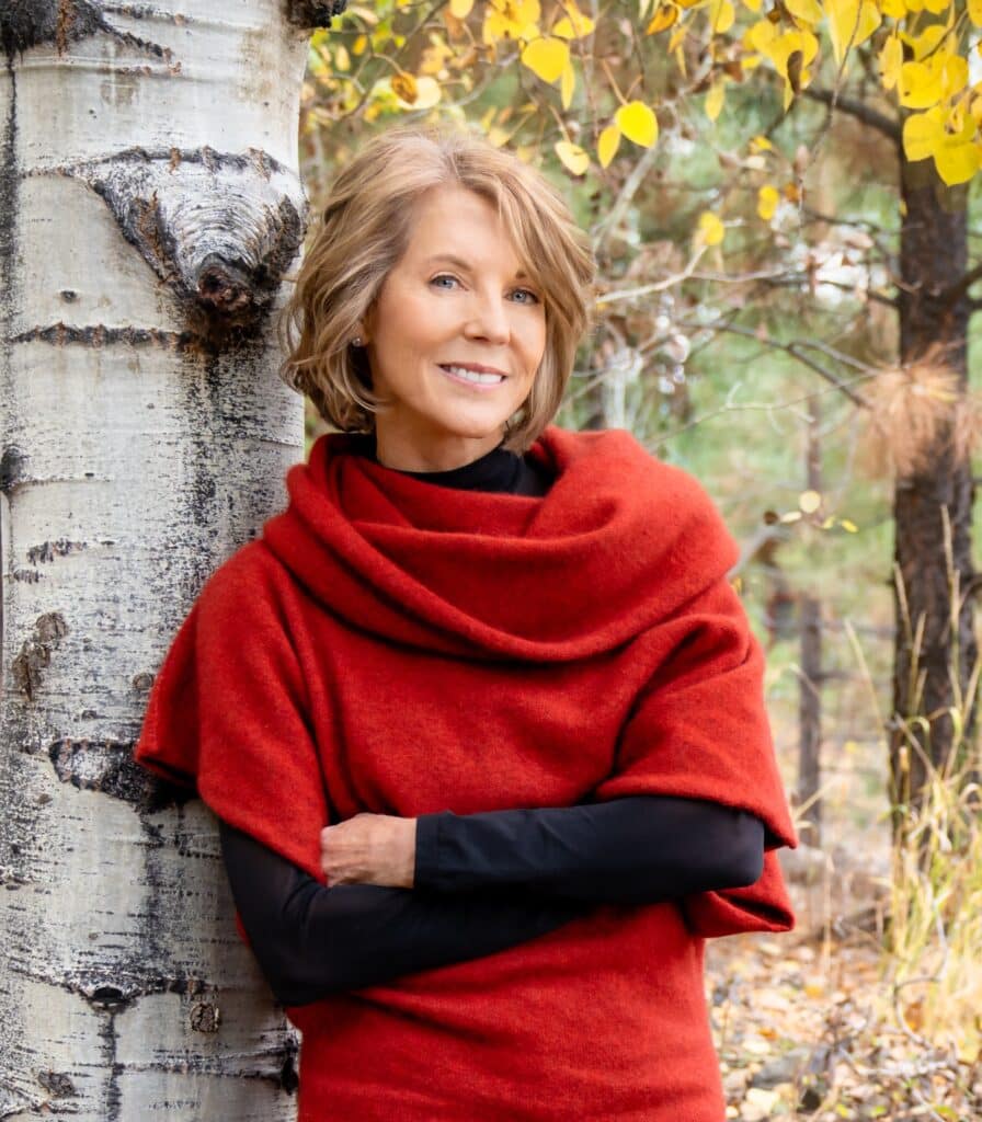 Susan McCandless portrait against tree